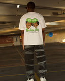Back view of model wearing the North Bioko Club Members Only Full Set with white graphic T-shirt and washed joggers