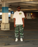 Model wearing the North Bioko Club Members Only Full Set with white graphic T-shirt and Black Washed graffiti joggers