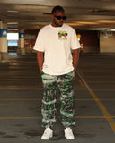 Full-length front view of model wearing the white Members Only T-shirt and Black Washed 5X graffiti joggers