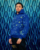 Three-quarter side view of model wearing the North Bioko Club Graffiti Hoodie in Cobalt Blue