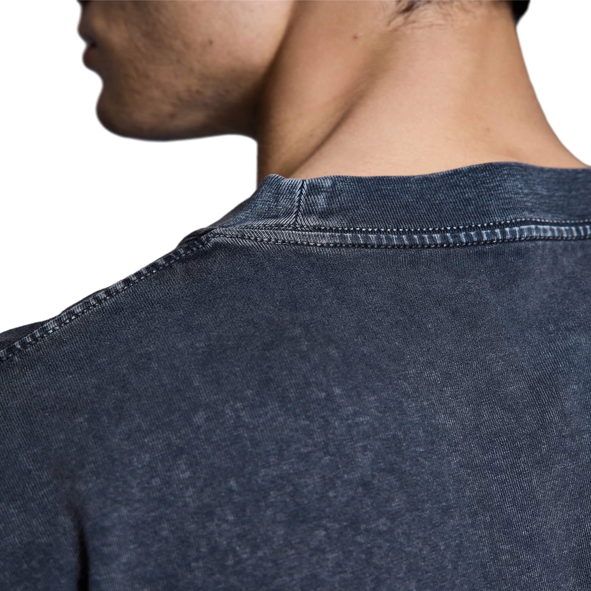 Washed black oversized North Bioko Club t-shirt showing relaxed fit and premium fabric