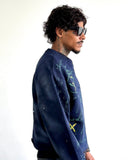 Side view of men's North Bioko Club 5X Graffiti Sweatshirt showing fitted silhouette and sleeve artwork