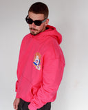 Side view of North Bioko Club Peach Hoodie in Hibiscus Pink showing dropped shoulders, hood and kangaroo pocket