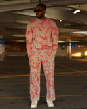 Model wearing the North Bioko Club Pink Acid Graffiti sweatshirt and matching joggers