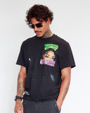 Three-quarter view of black Pretty Girls Love Motion T-Shirt showing relaxed boxy fit and distressed detailing