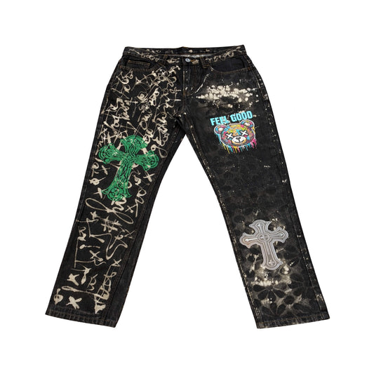Signal Noise hand-finished black denim jeans with bleach treatment, graffiti markings, and cross graphics by North Bioko Club.